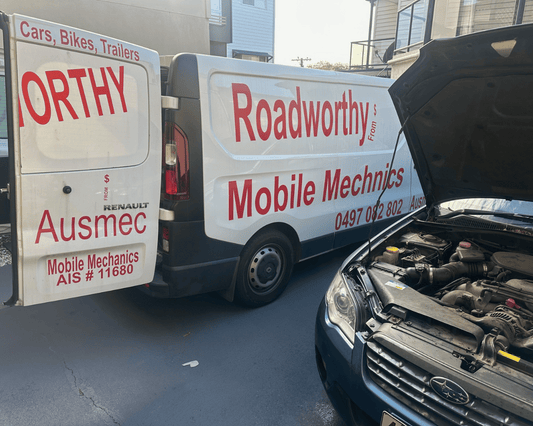 Bracken Ridge Mobile Roadworthy (Safety Certificate): Your car, your home, our convenience. Two mobile mechanics vans with 'NORTHY' and 'Roadworthy Mobile Mechanics' branding, one open with an engine compartment.