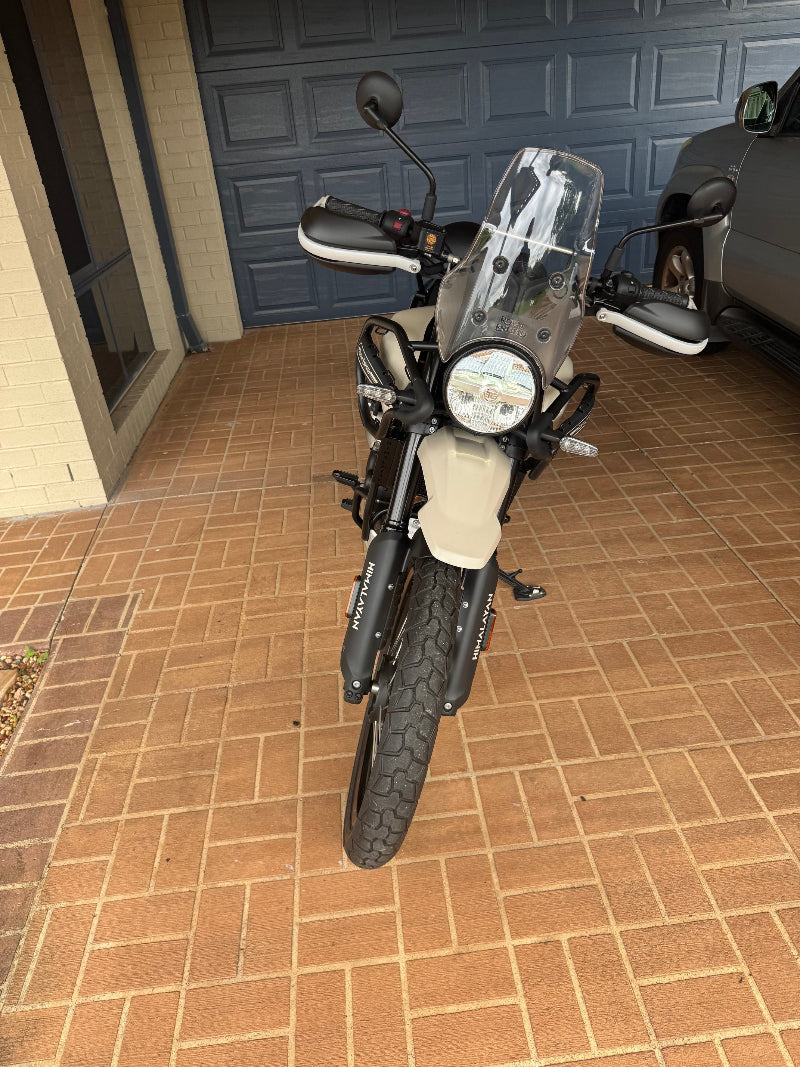 "Motorcycle undergoing its Upper Caboolture Mobile Roadworthy (Safety Certificate) inspection, conveniently conducted on a paved driveway." Motorcycle parked on a tiled floor with a door in the background