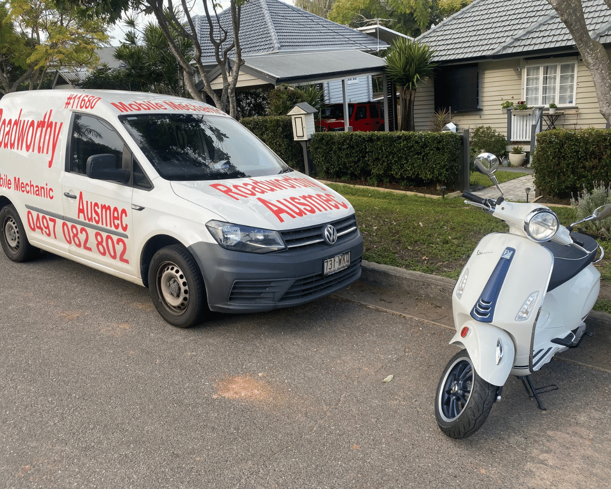 Moped in front of RWC van being inspected: A moped is meticulously inspected in front of a dedicated Roadworthy Certificate van, ready to receive its Brighton Mobile Roadworthy (Safety Certificate).