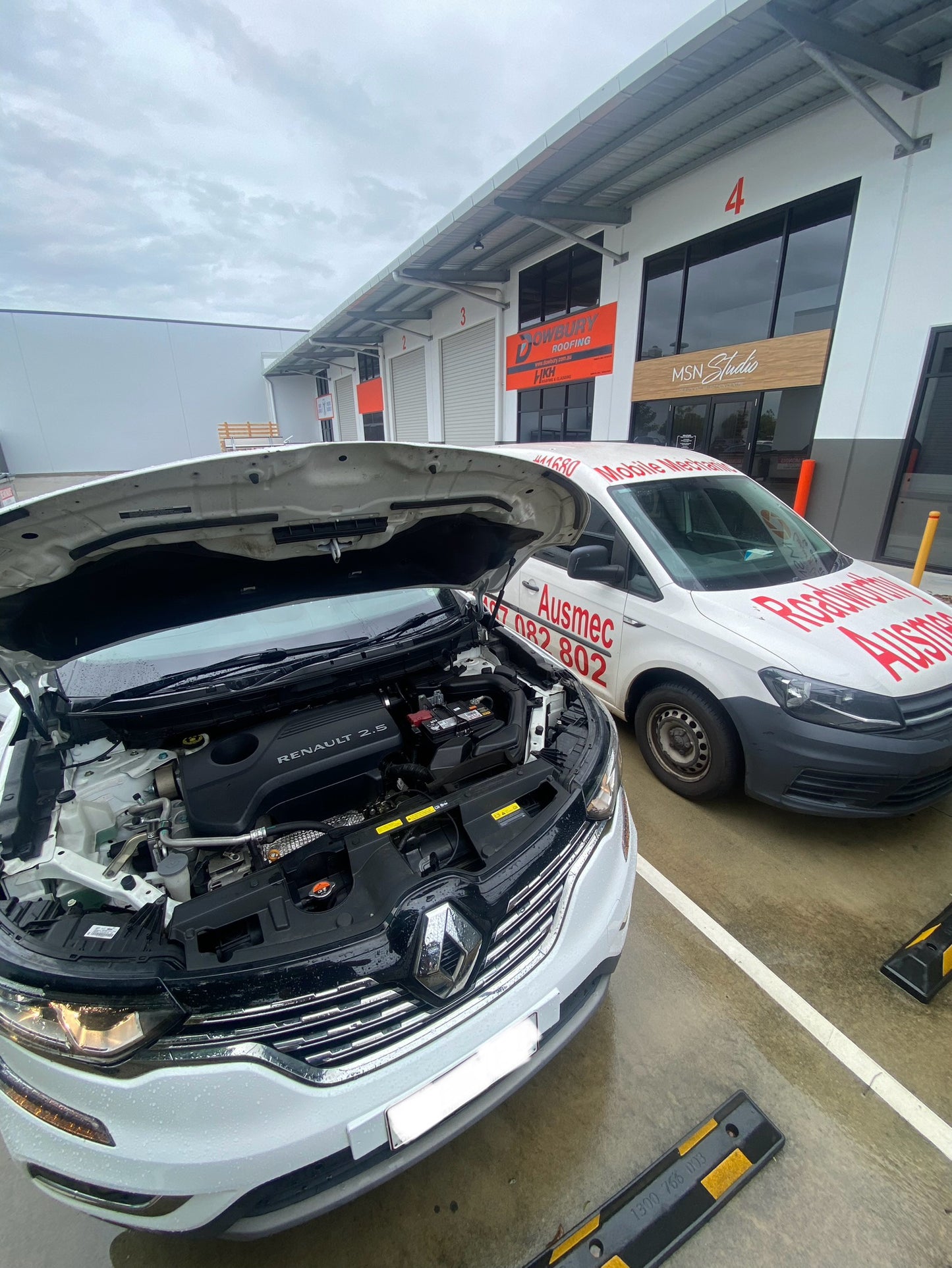 Pre Purchase Car inspection in a customers driveway on a white car