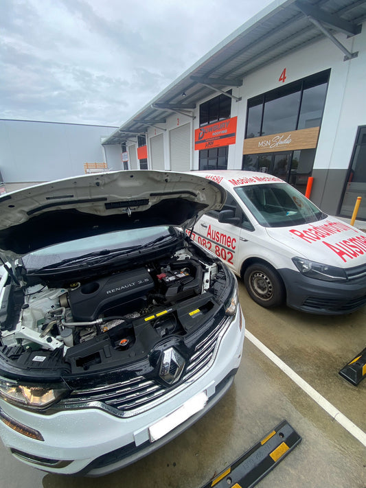 Pre Purchase Car inspection in a customers driveway on a white car
