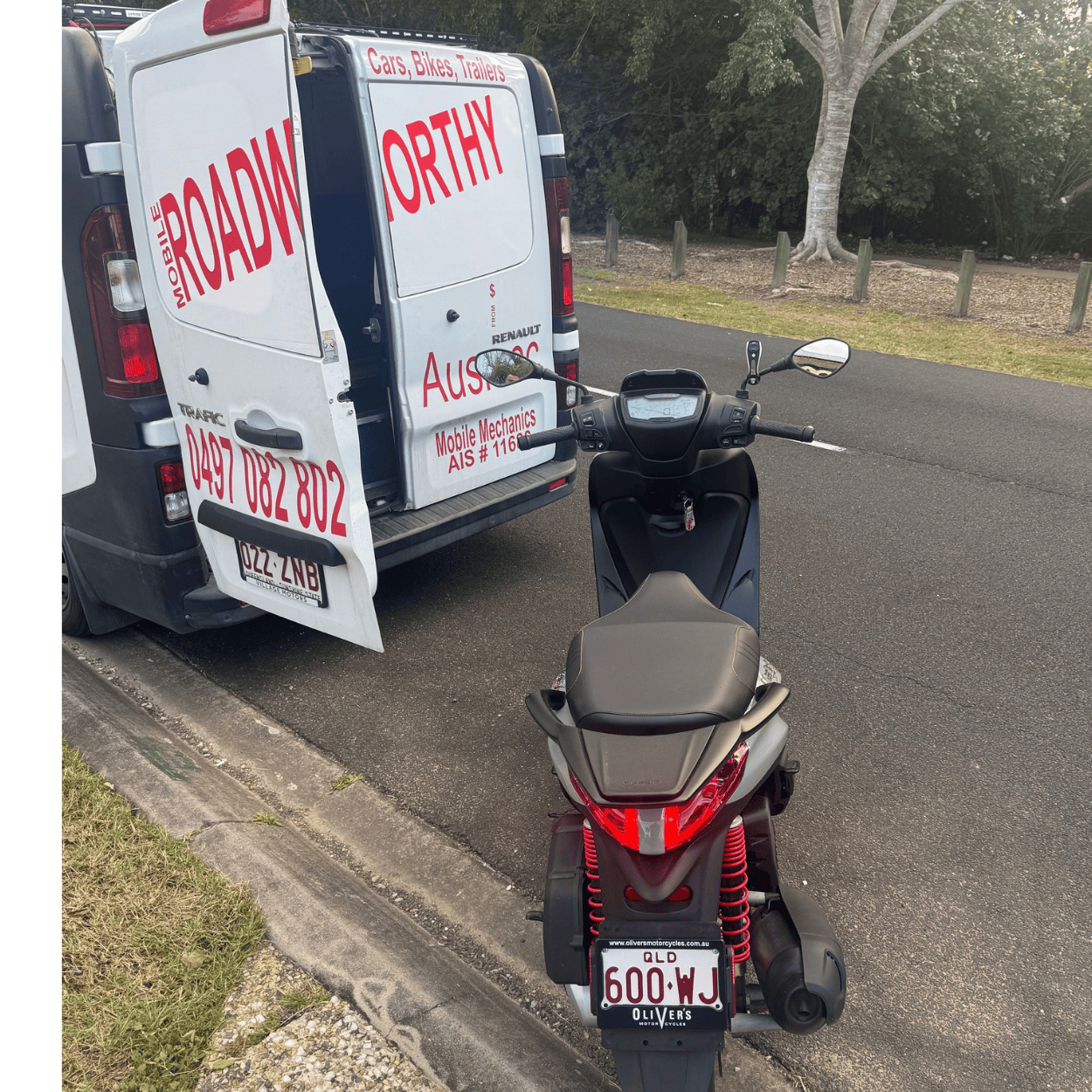 "Motorcycle moped receiving a thorough on-site Morayfield Mobile Roadworthy (Safety certificate) inspection." Scooter parked on a road next to a van with 'Roadworthy' branding.