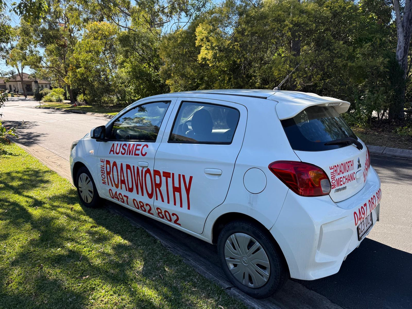 "Ausmec Mobile AIS (Approved Inspection Station) vehicle ready to provide a Sandgate Mobile Roadworthy (Safety Certificate) at your location." White car with 'Ausmec Roadworthy' branding parked on a street.