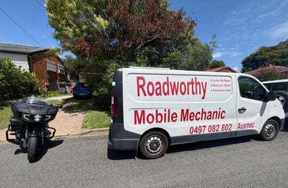 Roadworthy Mobile Mechanic van parked on a residential street with a motorcycle nearby in Ferny Grove