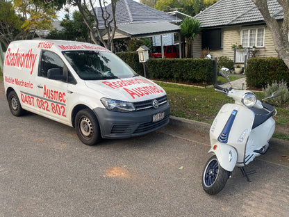 "Licensed mechanic conducting a Kallangur Mobile Roadworthy (Safety Certificate) inspection for a motorcycle or moped to issue an RWC." Van with advertisement text and a scooter on a residential street
