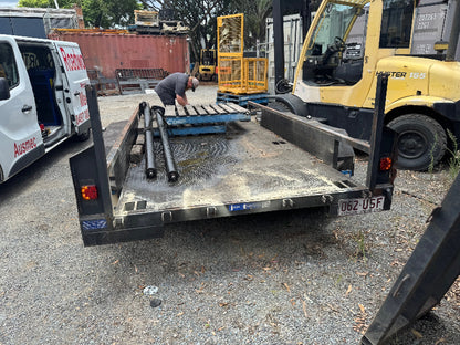 "Flatbed car trailer undergoing a Deception Bay Roadworthy (Safety certificate) inspection, with the Ausmec service van parked nearby."