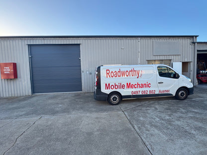 White van with 'Roadworthy Mobile Mechanic' branding parked outside a building.A general shot of a Murrumba Downs automotive workshop with a prominent sign indicating services, including Murrumba Downs Roadworthy (Safety Certificate) issuance.