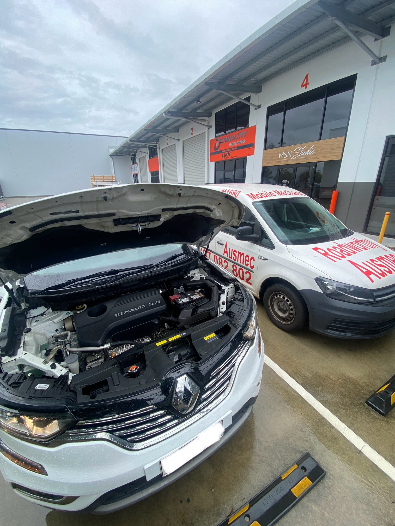 Pre Purchase Car inspection in a customers driveway on a white car