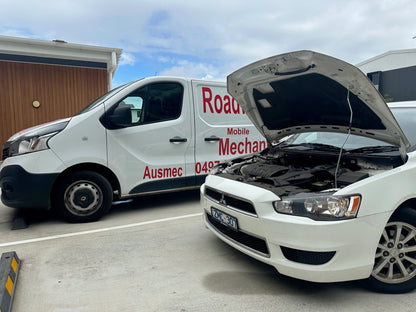 "Mitsubishi Lancer undergoing a Redcliffe Mobile Roadworthy (Safety Certificate) inspection, with our Ausmec AIS van visible nearby for convenient on-site service."