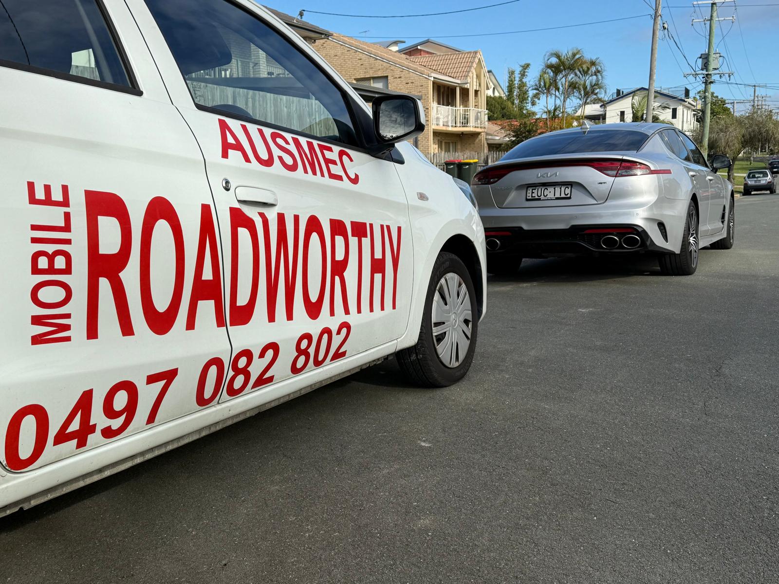 Ausmec vehicles heading to do inspections
Alt text: Ausmec Mobile Roadworthy vehicles ready to provide a mobile safety certificate inspection in Wavell Heights. Car with 'AUSMEC MOBILE ROADWORTHY' branding on a street.