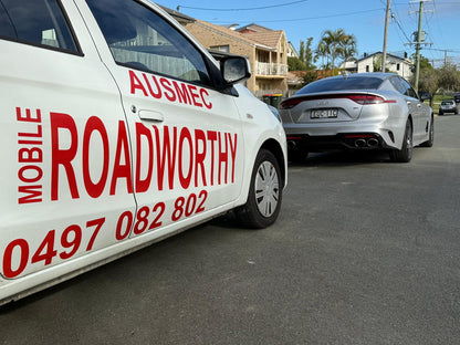 Ausmec vehicles heading to do inspections
Alt text: Ausmec Mobile Roadworthy vehicles ready to provide a mobile safety certificate inspection in Wavell Heights. Car with 'AUSMEC MOBILE ROADWORTHY' branding on a street.